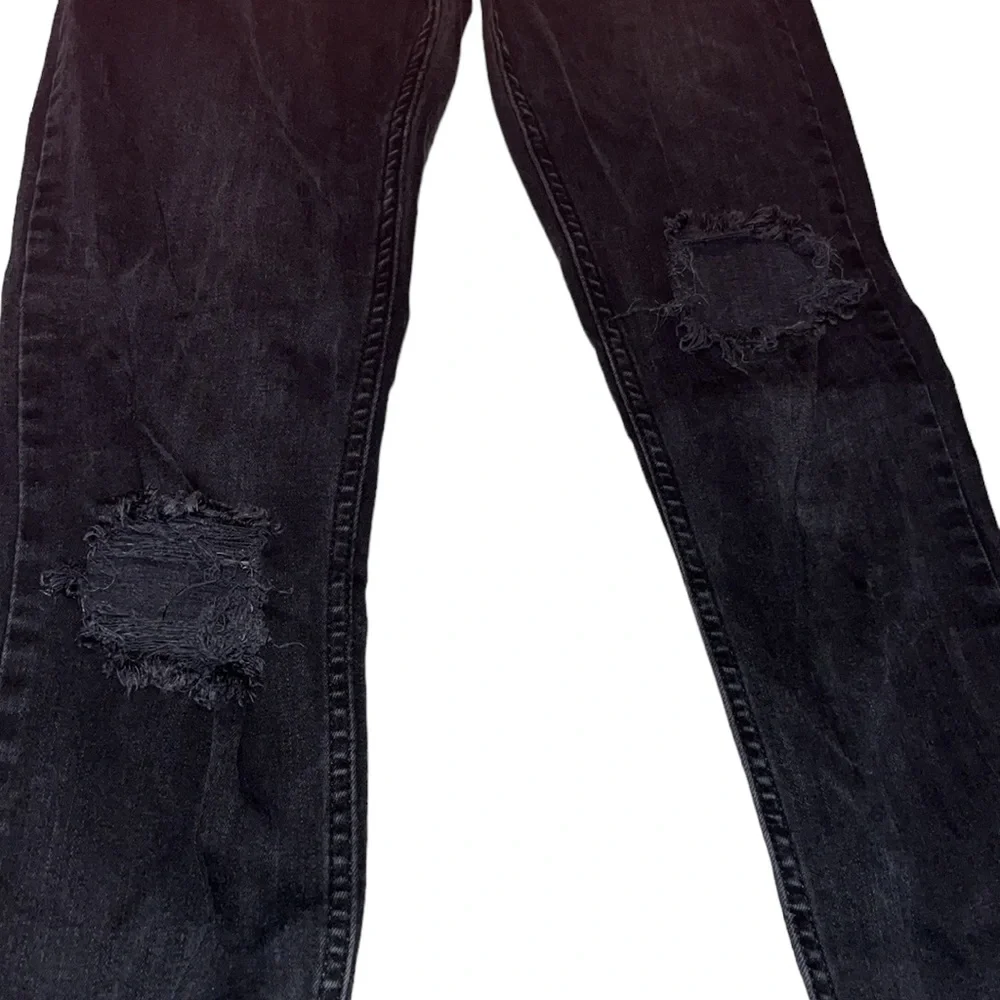 Free People size 27 Black Wash skinny jeans distressed with raw hem
